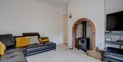 Downstairs seating area.  Log burner, tv and wi-fi. Underfloor heating