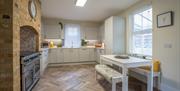 Open plan kitchen with seating area and dining table