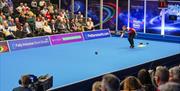 Julie Forrest plays in a match at the 2025 World Indoor Bowls Championships